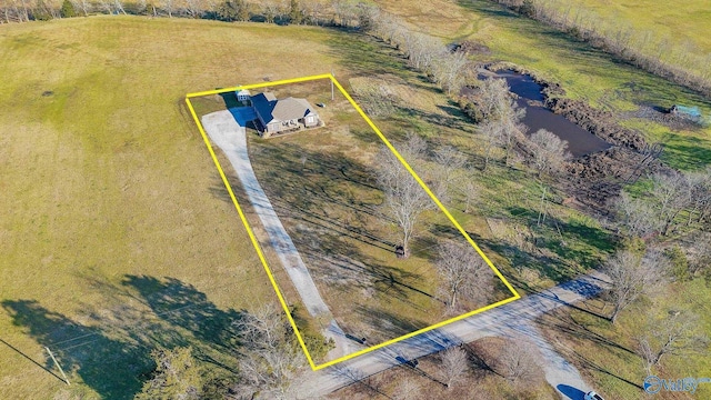 birds eye view of property with a rural view