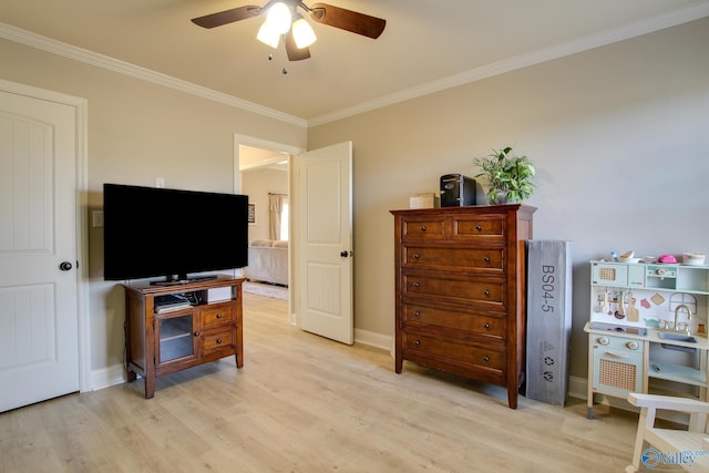 interior space with ornamental molding, light hardwood / wood-style floors, and ceiling fan