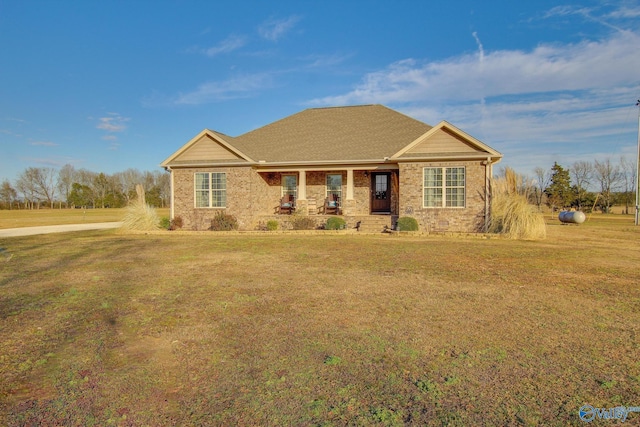 view of front of property with a porch and a front yard