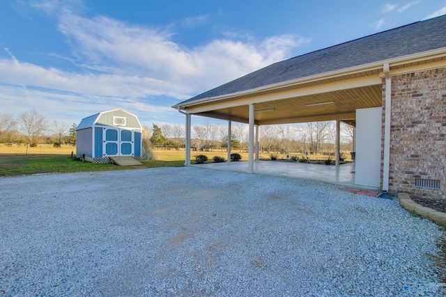 view of patio featuring a shed