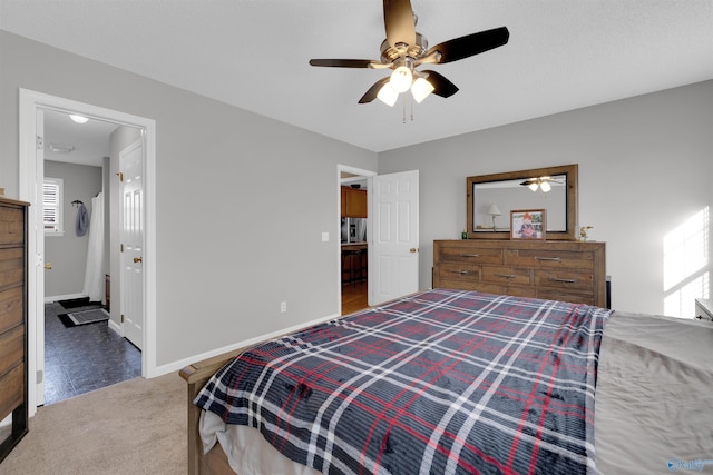 carpeted bedroom featuring ceiling fan and multiple windows