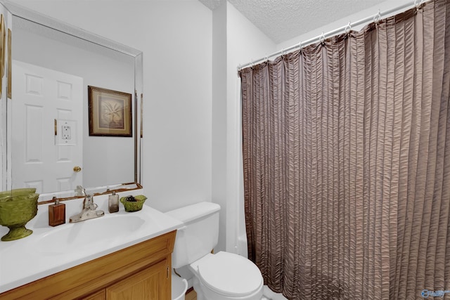 full bathroom featuring vanity, toilet, a textured ceiling, and shower / tub combo