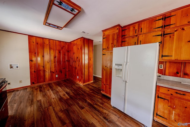 2551 Little Creek Rd, Arab, AL 35016 - kitchen featuring white refrigerator with ice dispenser, dark wood-style flooring, brown cabinets, and baseboards