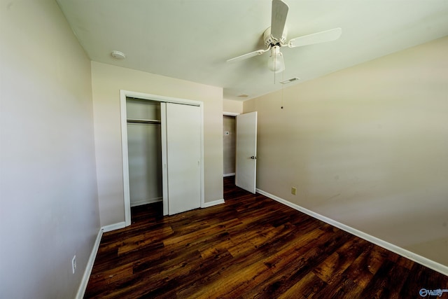 2551 Little Creek Rd, Arab, AL 35016 - unfurnished bedroom featuring baseboards, wood finished floors, a closet, and ceiling fan