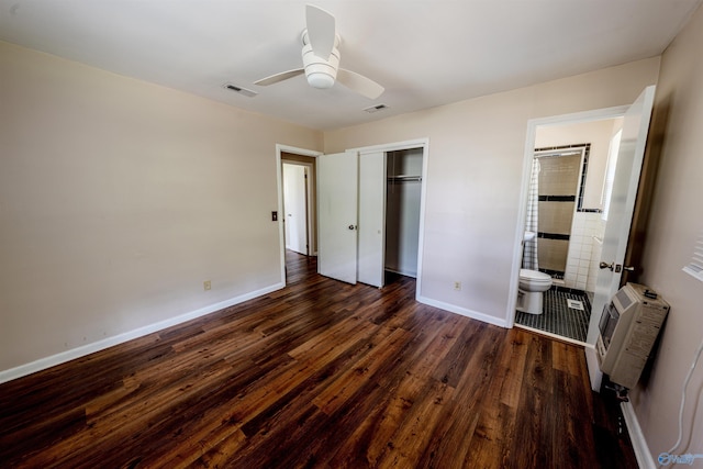 2551 Little Creek Rd, Arab, AL 35016 - unfurnished bedroom featuring dark wood finished floors, baseboards, a closet, ensuite bathroom, and heating unit