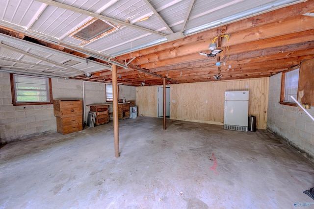 2551 Little Creek Rd, Arab, AL 35016 - garage featuring freestanding refrigerator and concrete block wall