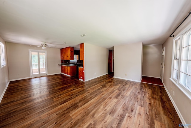 2551 Little Creek Rd, Arab, AL 35016 - unfurnished living room with dark wood finished floors, baseboards, and ceiling fan