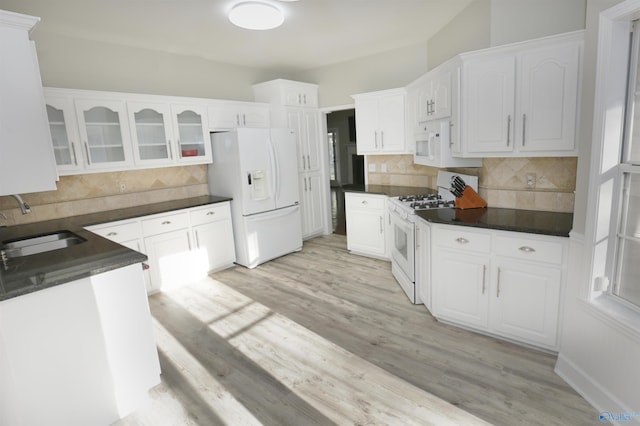 kitchen with white cabinetry, white appliances, sink, and light wood-type flooring