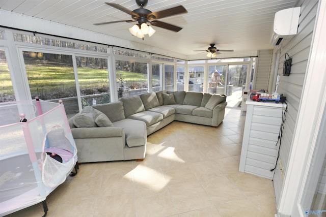 sunroom / solarium featuring ceiling fan, a wall unit AC, and a healthy amount of sunlight