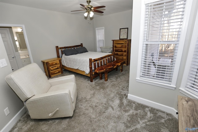 carpeted bedroom featuring ensuite bathroom and ceiling fan