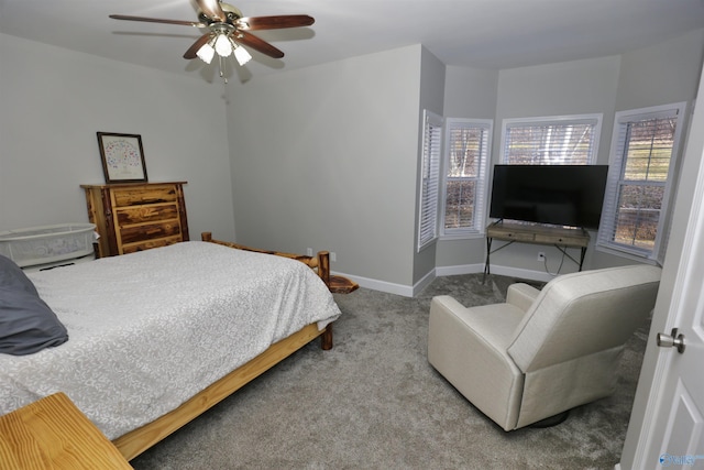 bedroom with ceiling fan, carpet floors, and multiple windows