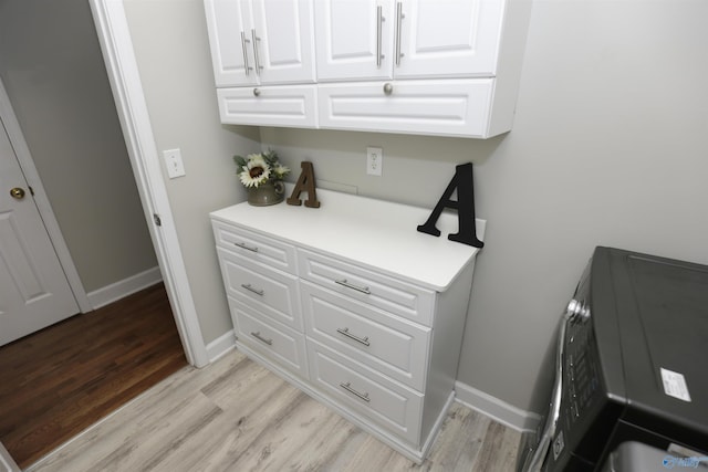 interior space featuring white cabinetry and light wood-type flooring