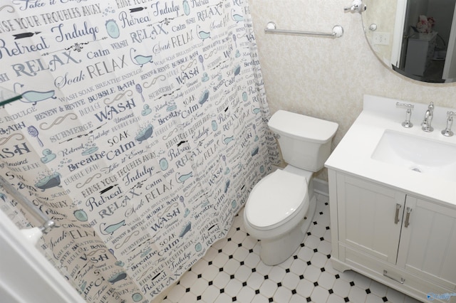 bathroom with vanity, a shower with curtain, and toilet