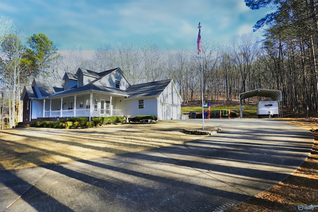 exterior space with a carport and covered porch