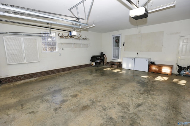 garage featuring a garage door opener and refrigerator