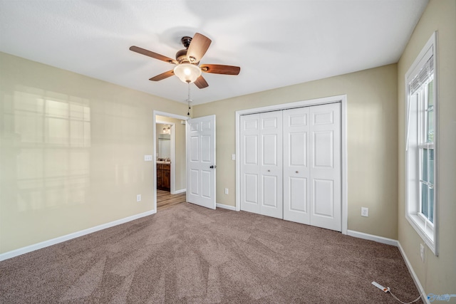 unfurnished bedroom featuring carpet flooring, a closet, and ceiling fan