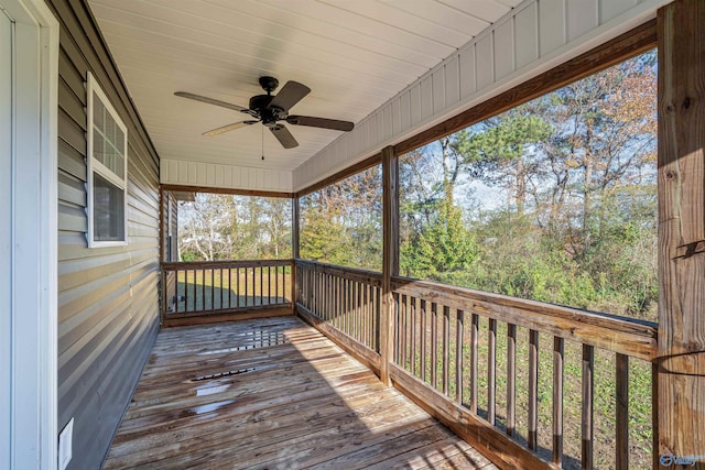 wooden terrace featuring ceiling fan