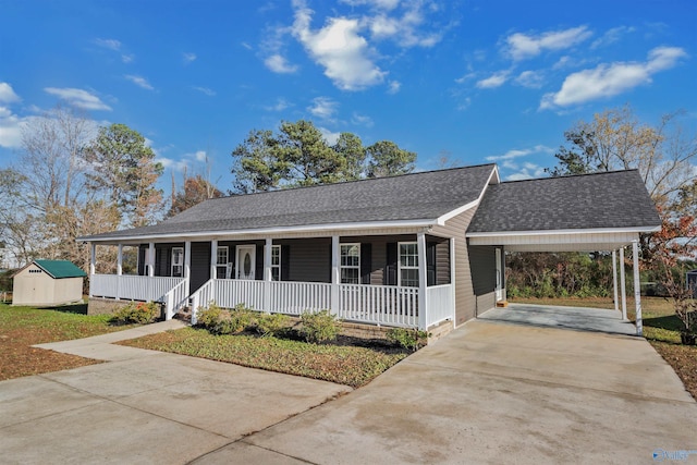 ranch-style home with a storage shed, a porch, and a carport