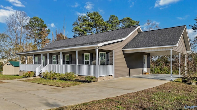 view of front of home with a porch and a carport