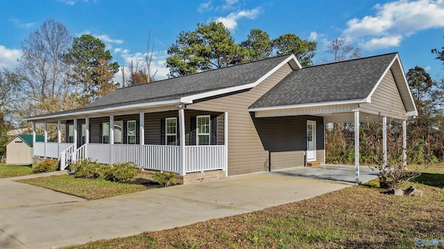 view of front facade featuring a porch and a carport