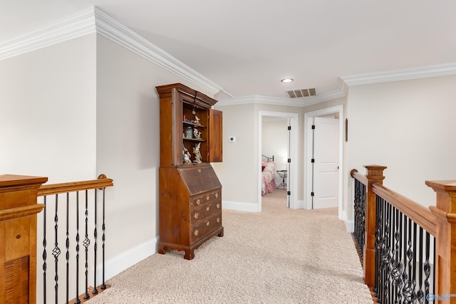 hall with light carpet and crown molding