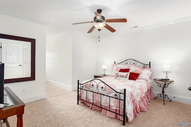 carpeted bedroom featuring ornamental molding and ceiling fan