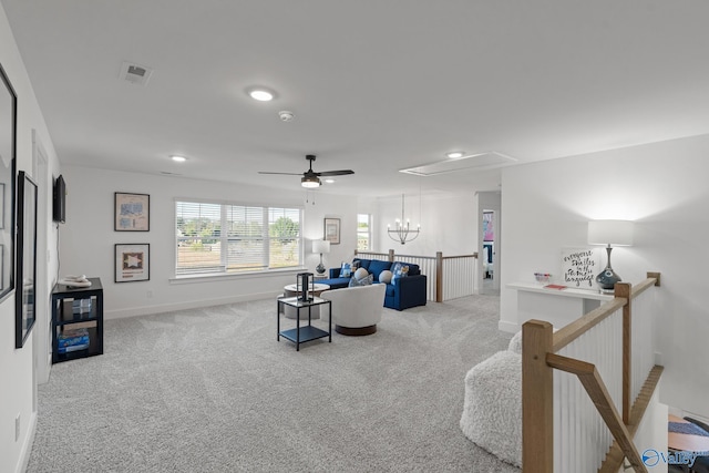 living room with light colored carpet and ceiling fan