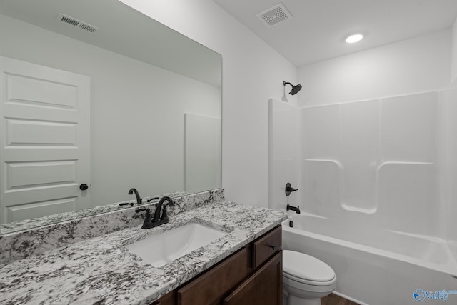 full bathroom featuring vanity, toilet, and washtub / shower combination