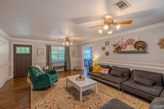 610 Grover Davis Rd, Hamilton, AL 35570 - living room featuring wood finished floors, a ceiling fan, crown molding, and a textured ceiling