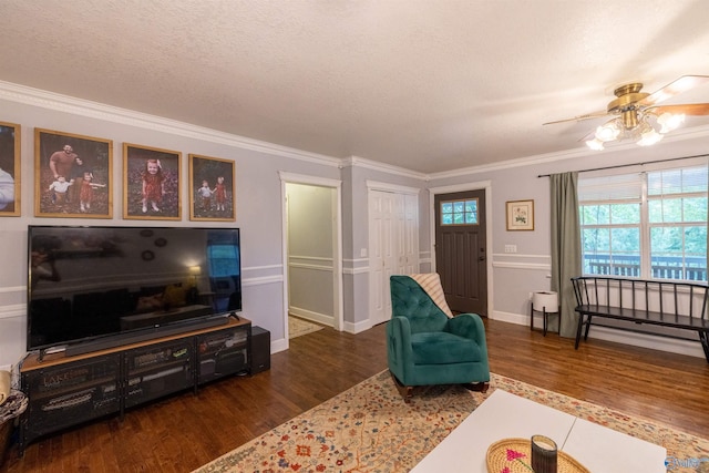 610 Grover Davis Rd, Hamilton, AL 35570 - living room featuring wood finished floors, crown molding, a ceiling fan, baseboards, and a textured ceiling