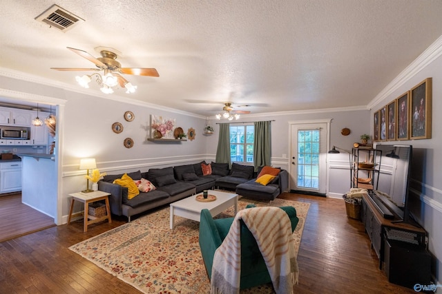 610 Grover Davis Rd, Hamilton, AL 35570 - living area featuring dark wood-type flooring, a ceiling fan, a textured ceiling, and crown molding