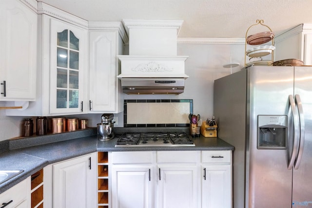 610 Grover Davis Rd, Hamilton, AL 35570 - kitchen featuring appliances with stainless steel finishes, dark countertops, white cabinetry, glass insert cabinets, and ornamental molding