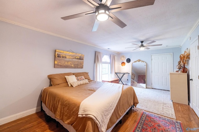 610 Grover Davis Rd, Hamilton, AL 35570 - bedroom with crown molding, wood finished floors, baseboards, and a ceiling fan
