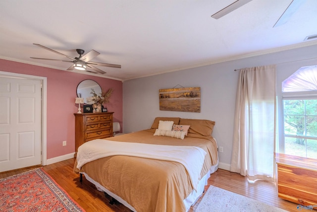 610 Grover Davis Rd, Hamilton, AL 35570 - bedroom with light wood-type flooring, ornamental molding, ceiling fan, and baseboards