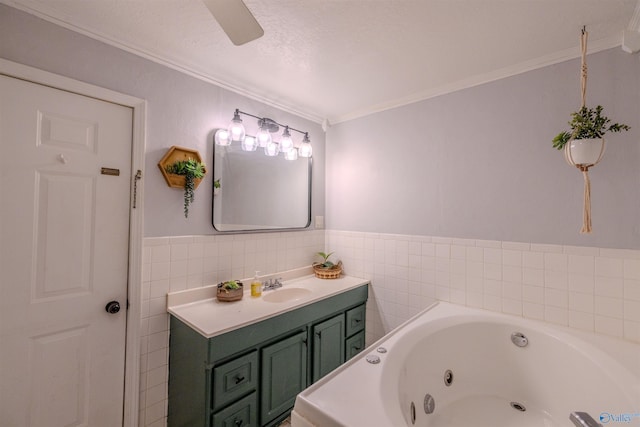 610 Grover Davis Rd, Hamilton, AL 35570 - bathroom with ornamental molding, a jetted tub, vanity, tile walls, and wainscoting