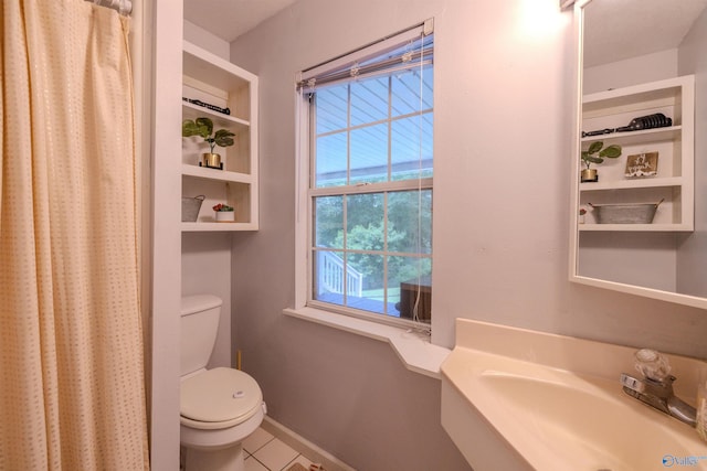 610 Grover Davis Rd, Hamilton, AL 35570 - full bath featuring a sink, toilet, tile patterned flooring, and curtained shower