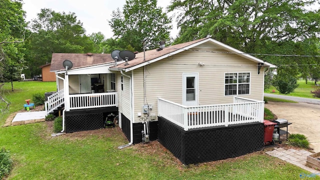 610 Grover Davis Rd, Hamilton, AL 35570 - rear view of property with a yard, a deck, and view of wooded area