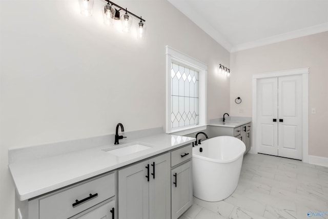 bathroom featuring vanity, crown molding, and a tub