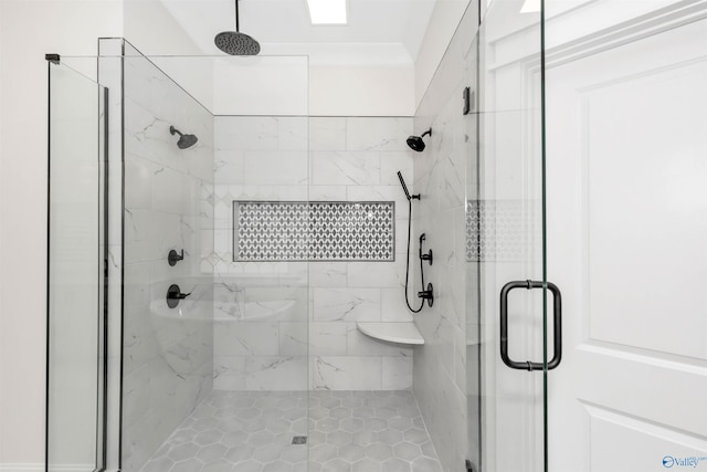 bathroom featuring a shower with shower door