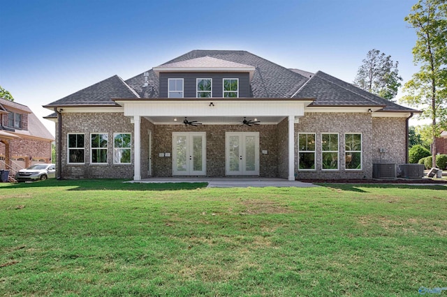 back of house featuring a yard, french doors, ceiling fan, and central air condition unit