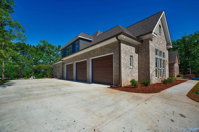 view of side of home featuring a garage