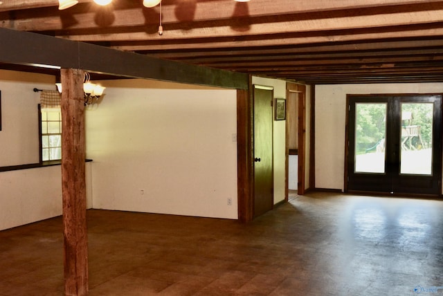 basement with tile patterned floors and french doors