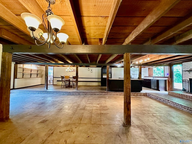 interior space featuring a large fireplace and a notable chandelier