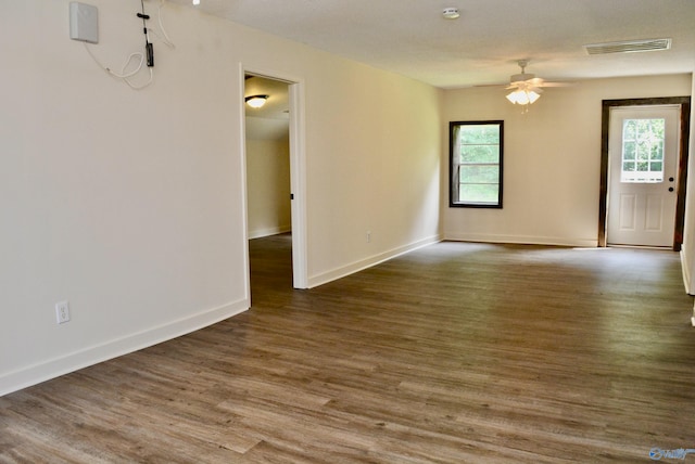 empty room featuring ceiling fan and hardwood / wood-style floors