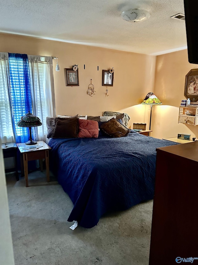 1212 Twin Lake Cir SW, Hartselle, AL 35640 - carpeted bedroom with a textured ceiling