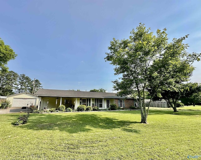1212 Twin Lake Cir SW, Hartselle, AL 35640 - ranch-style house with a front lawn and an attached garage