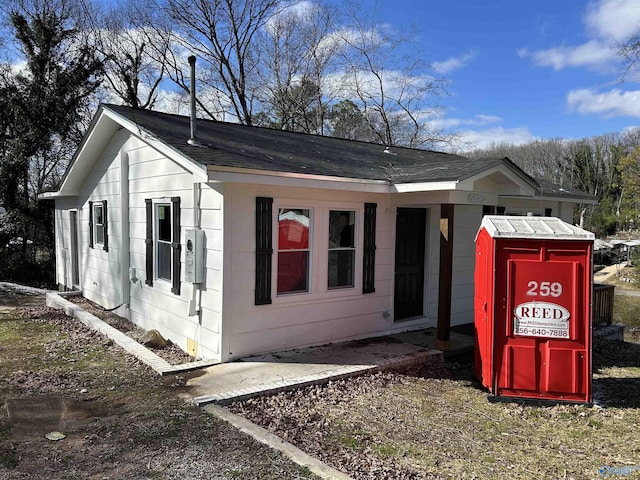 view of home's exterior featuring a shingled roof