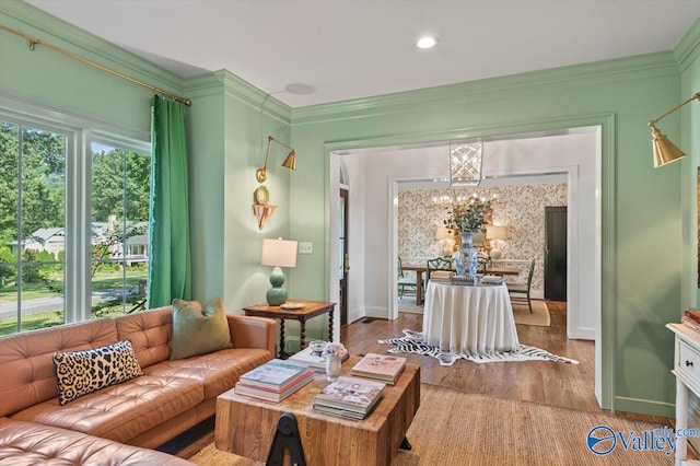 interior space with ornamental molding, wood finished floors, and a healthy amount of sunlight