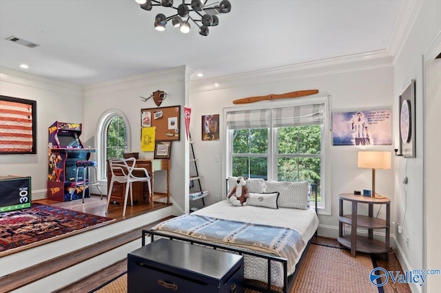 bedroom with visible vents, ornamental molding, wood finished floors, and recessed lighting