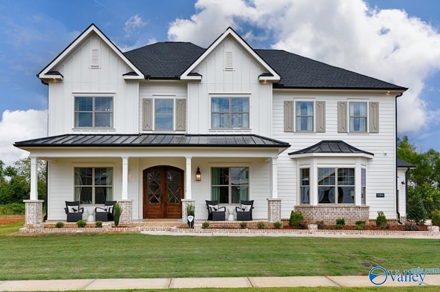 view of front of house featuring a front yard and a porch